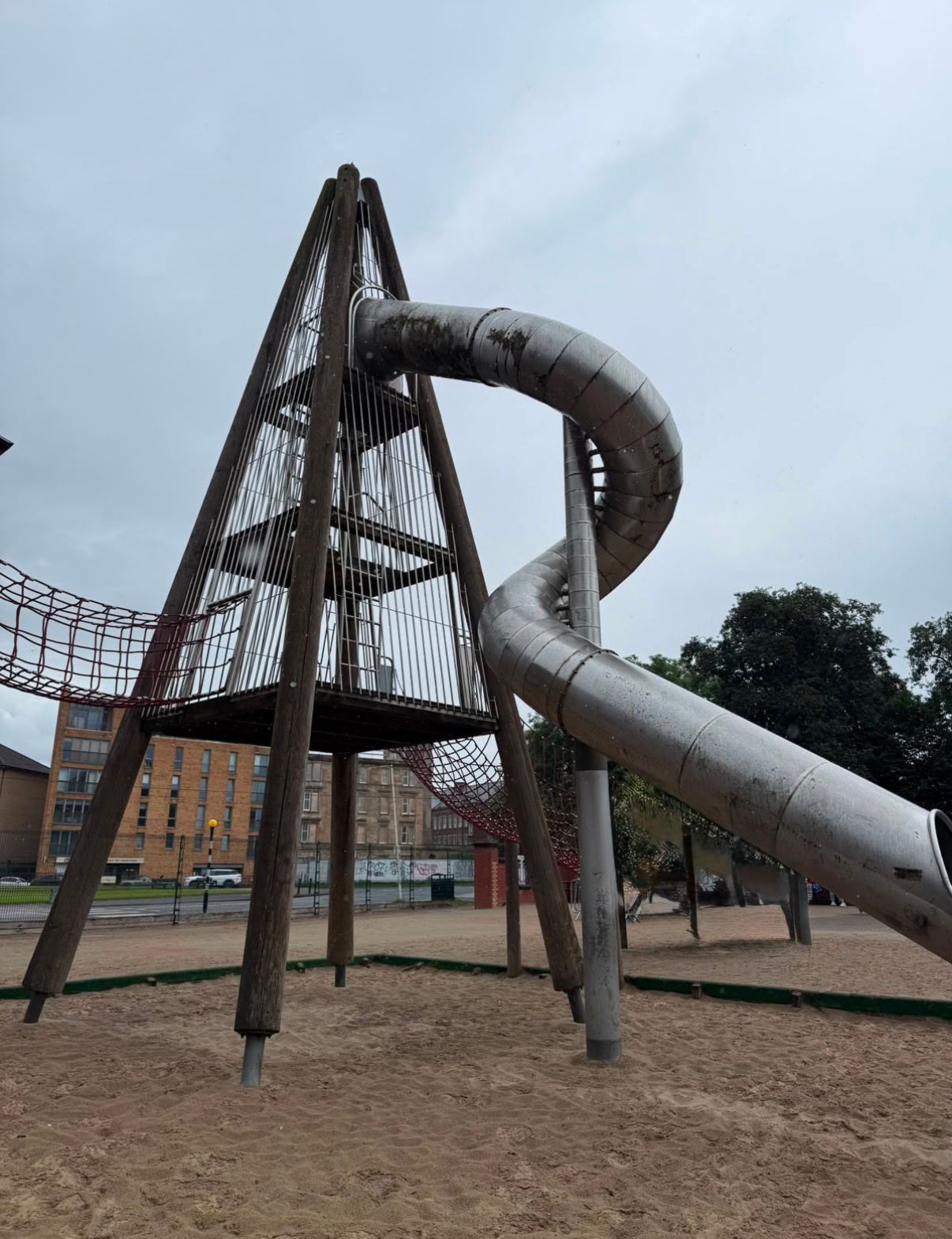 Wooden climbing tower with a spiral slide