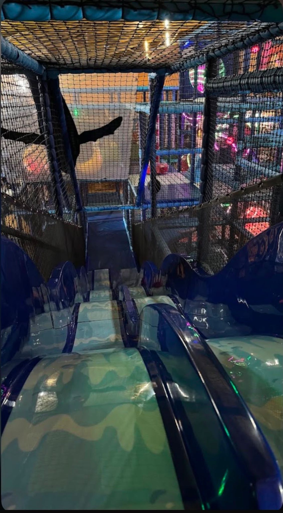 Wave-patterned slides at the soft play centre