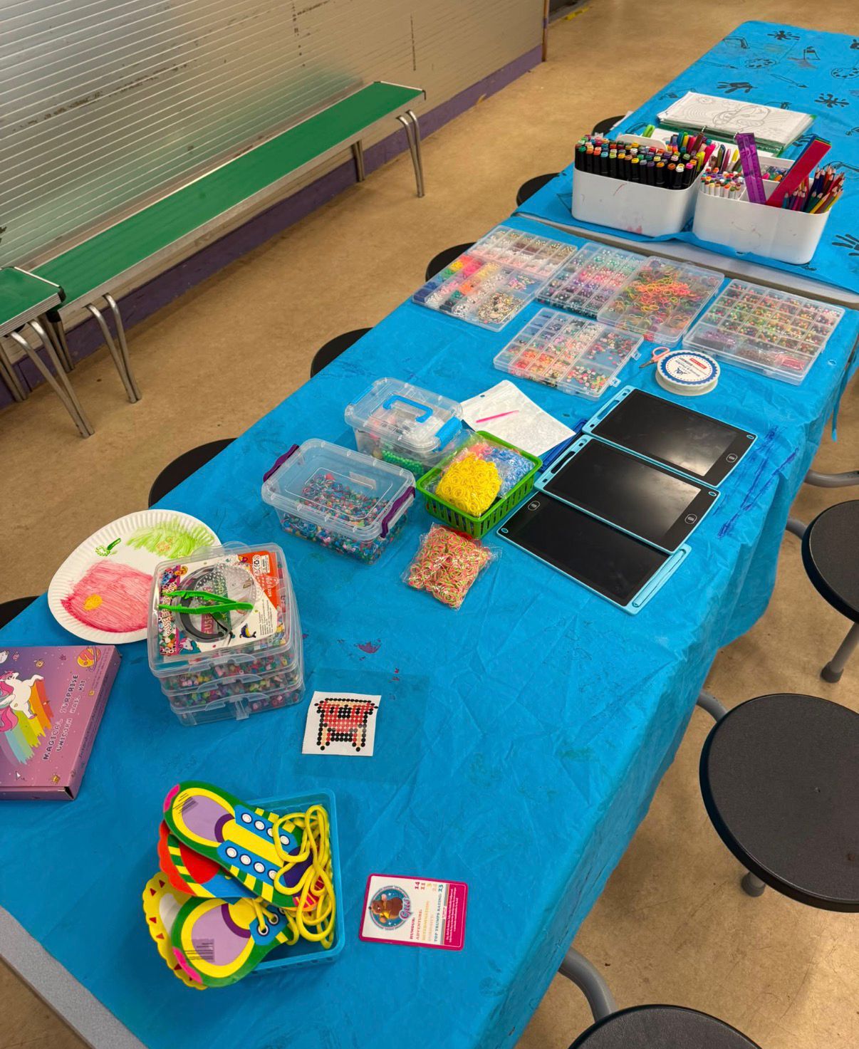 Beads, bands and drawing tablets at the activity table